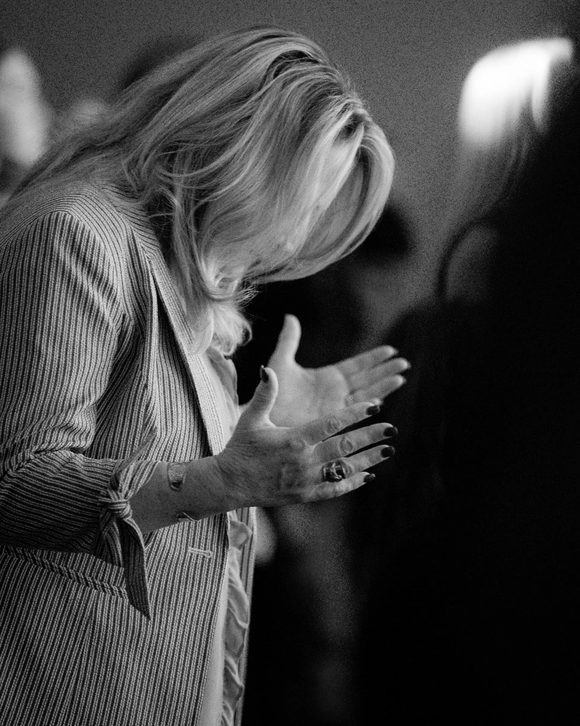 A woman praying with her hands open