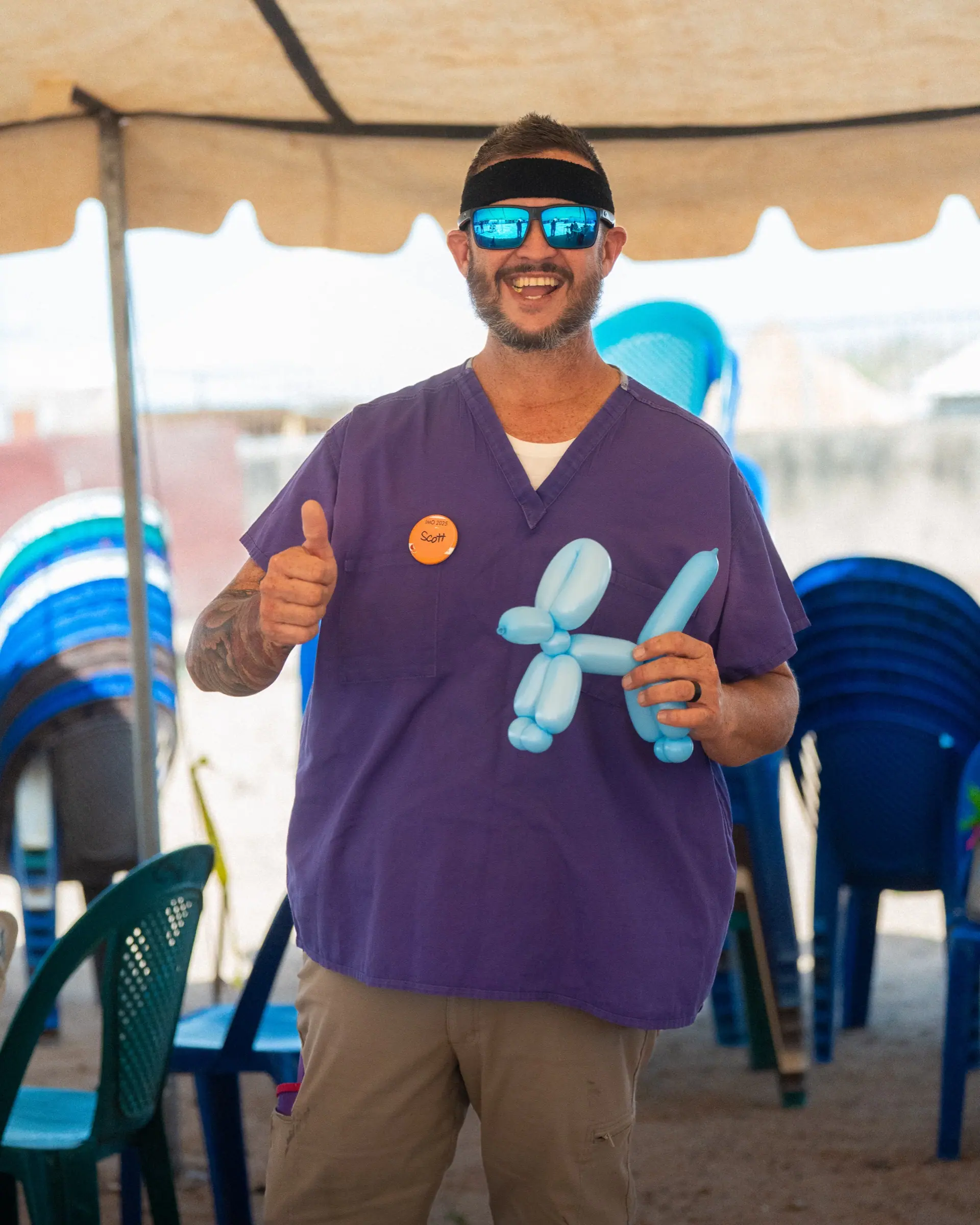 A Rock volunteer giving a thumbs up on a mission trip