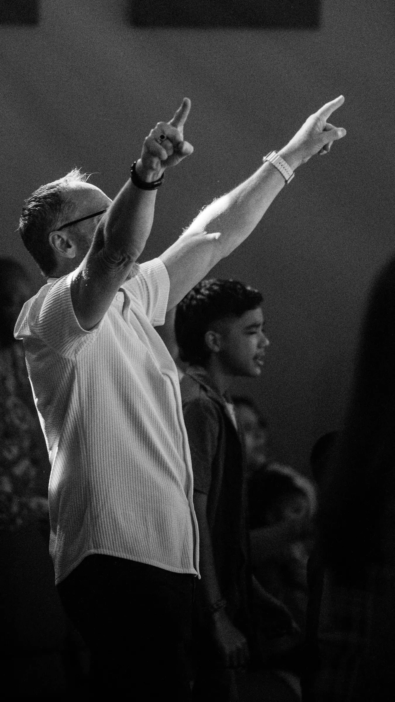 A father and son worshiping together